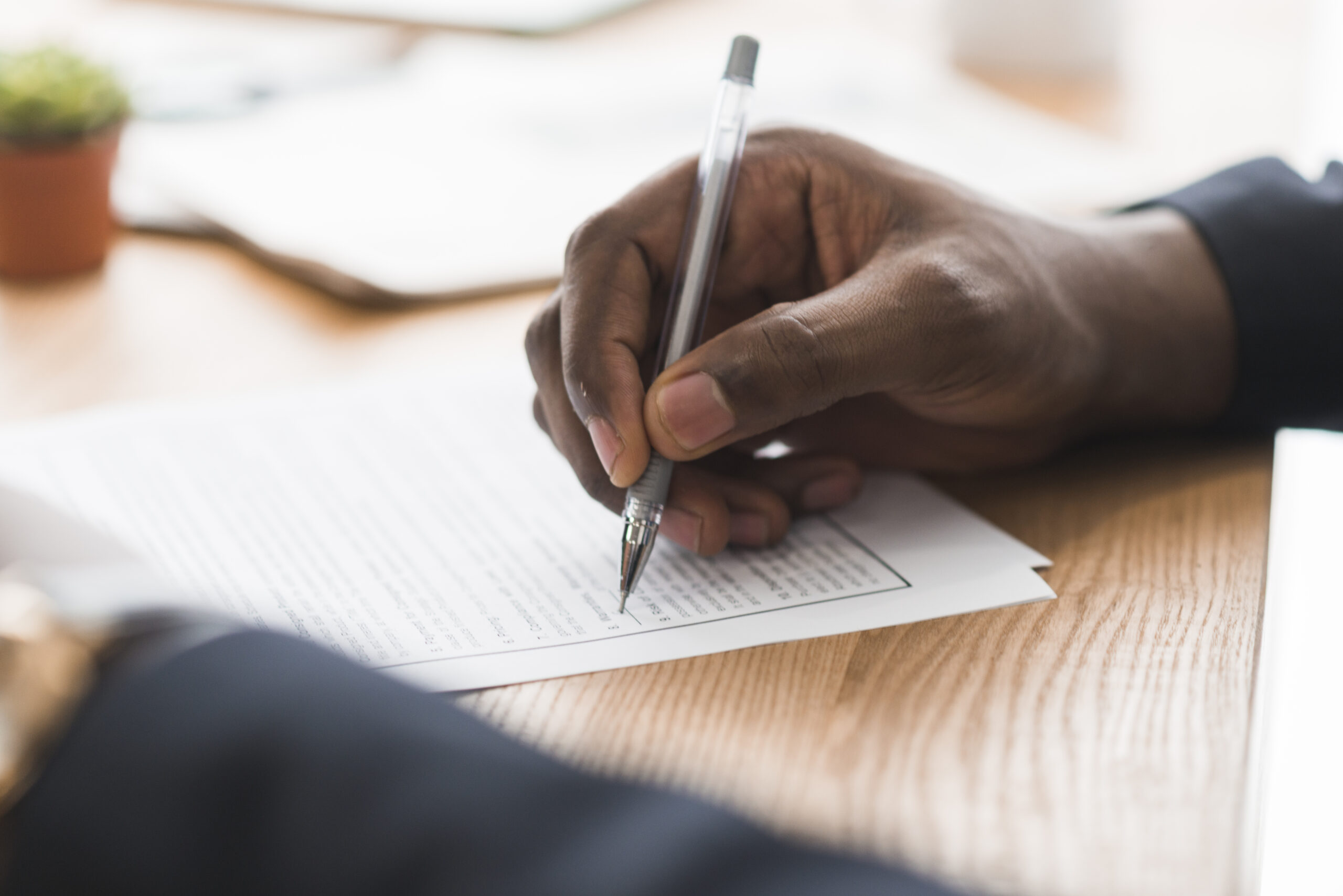 Home crop businessman signing papers